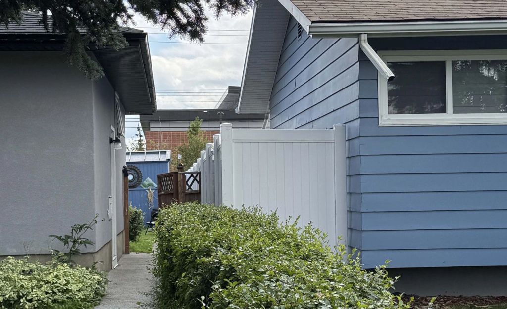 Blue house next to gray house 1024x625