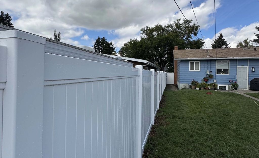 Fences near blue house 1024x625